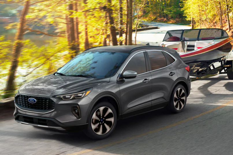 Gray 2026 Ford Escape towing a boat