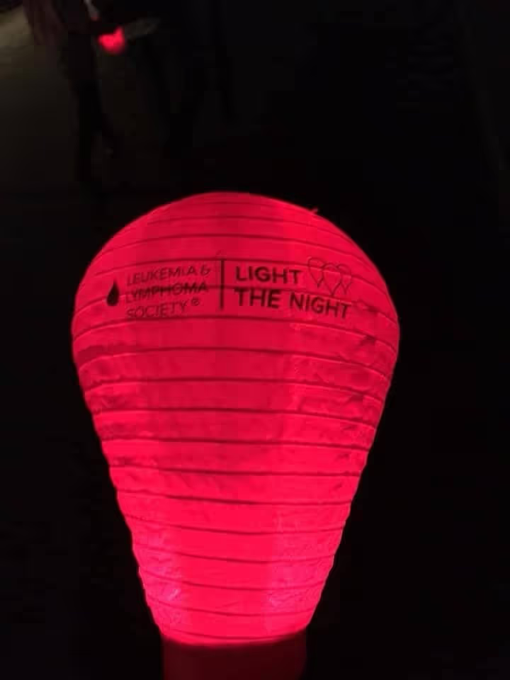 Red Light The Night lantern glowing in the dark.