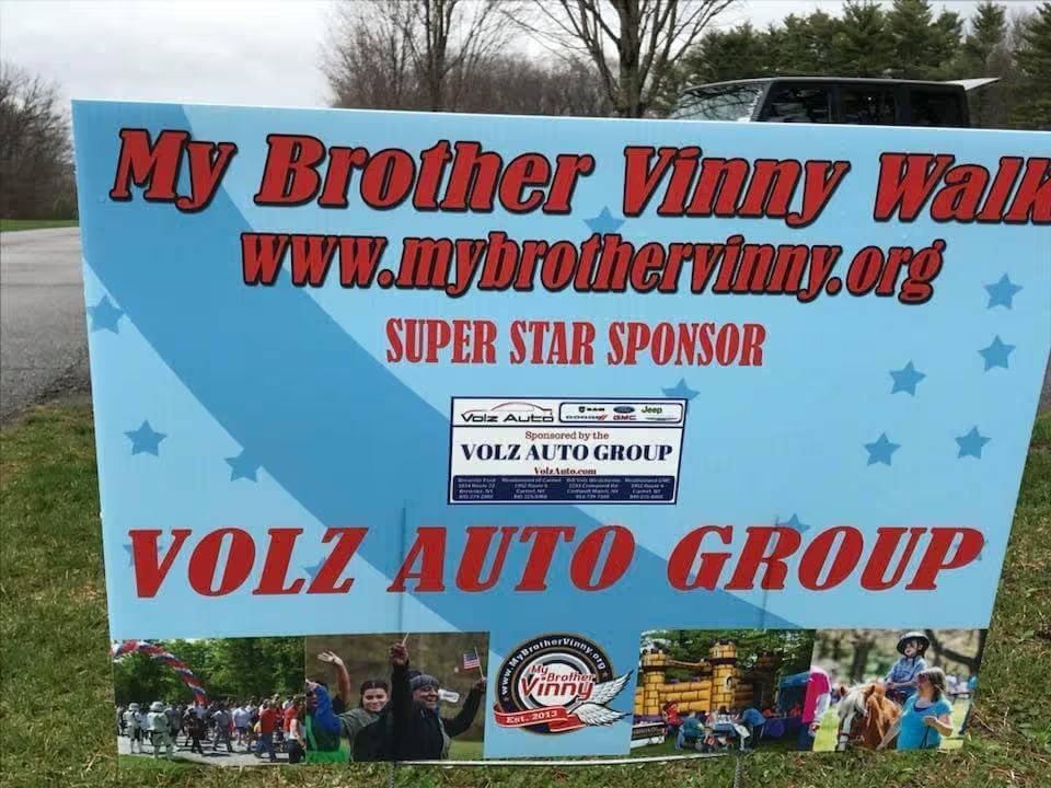 My Brother Vinny Walk sponsor sign from Volz Auto Group.